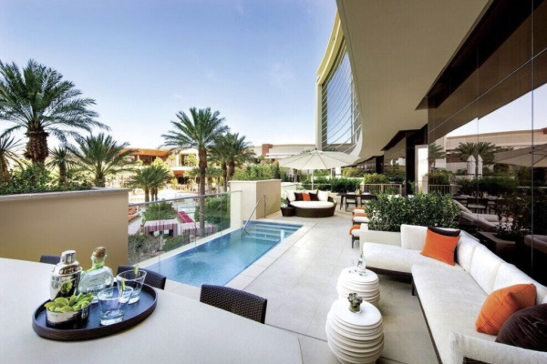 Photo of a pool and couch on an outdoor balcony at one of the suites at Red Rock Casino Resort & Spa in Las Vegas